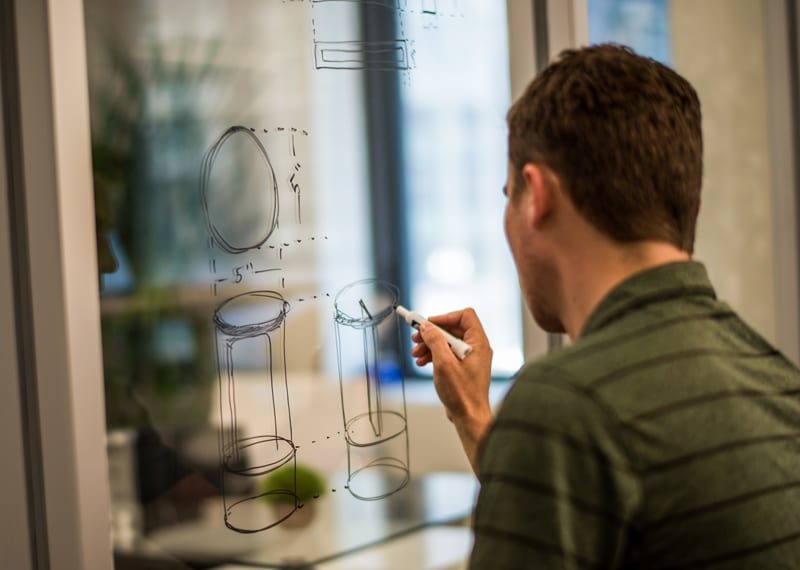 Designer Dry Erase Sketch on Glass of a Custom Nasdaq Capsule Award by ChenRui Gift