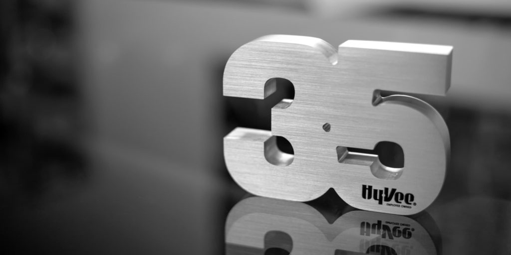Corporate years of service award made from EDM Wire cut metal numbers.