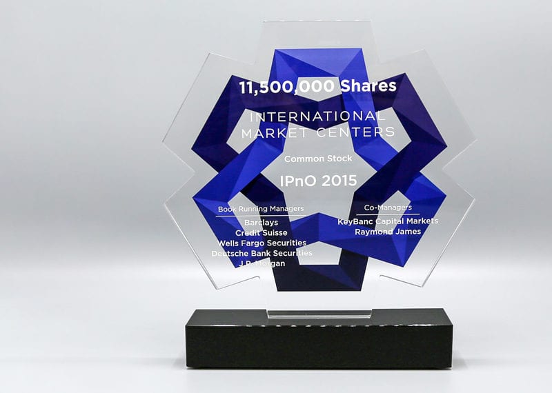 Waterjet crystal financial dealtoy with digital print graphic in background